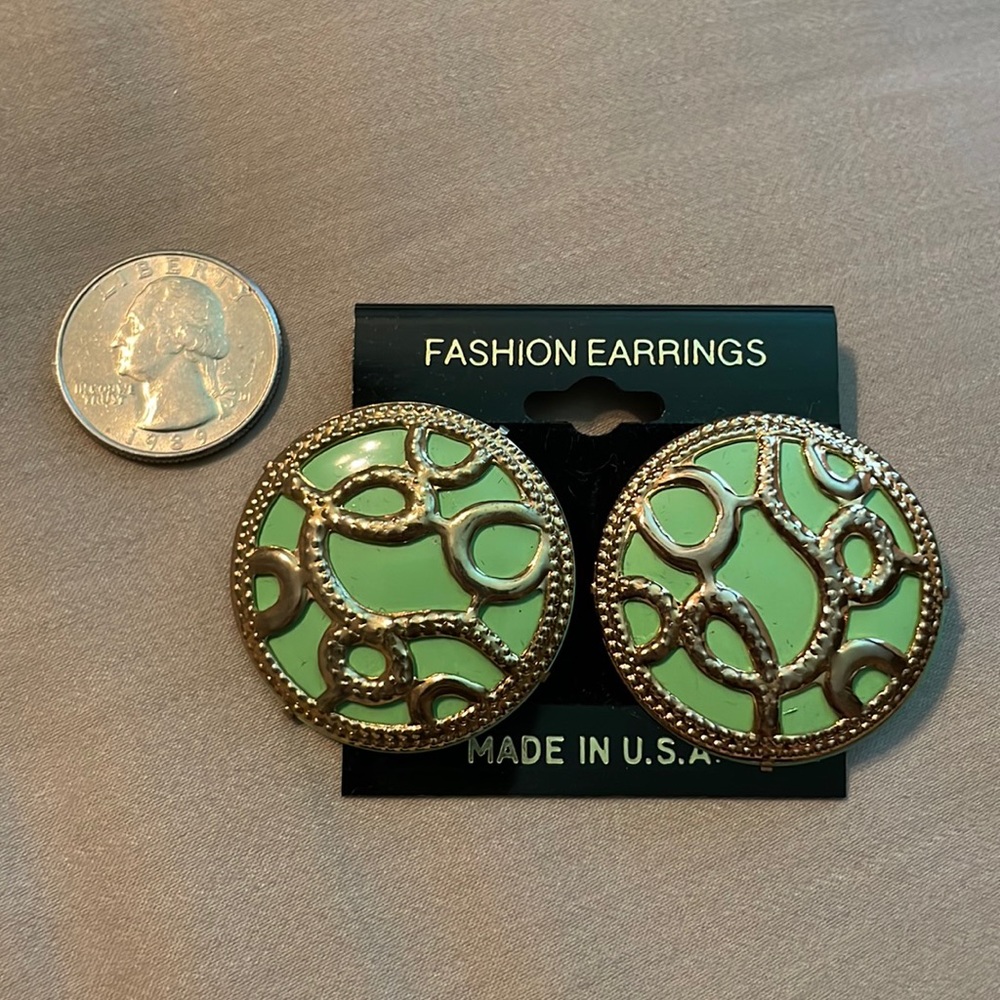 Pale green and gold design earrings